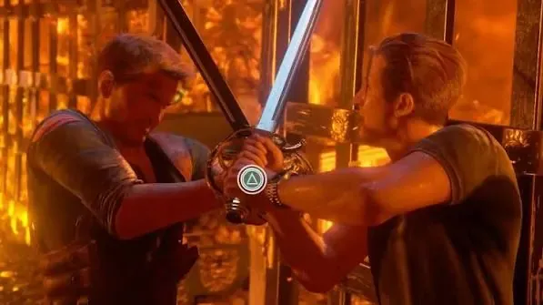 Nathan Drake and Rafe locked sword to sword, a triangle button prompt over the blades.